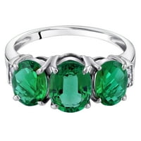 Oravo ct ovalni oblik stvorio je smaragdni i dijamantni prsten od tri kamena u 14k bijelom zlatu
